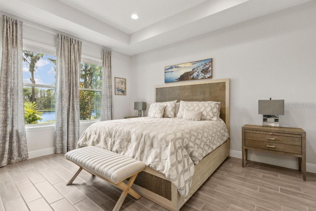 17936 Adrift Road Winter Garden, FL 34787 - Photo 20 of 44 a bedroom with a bed and a couch