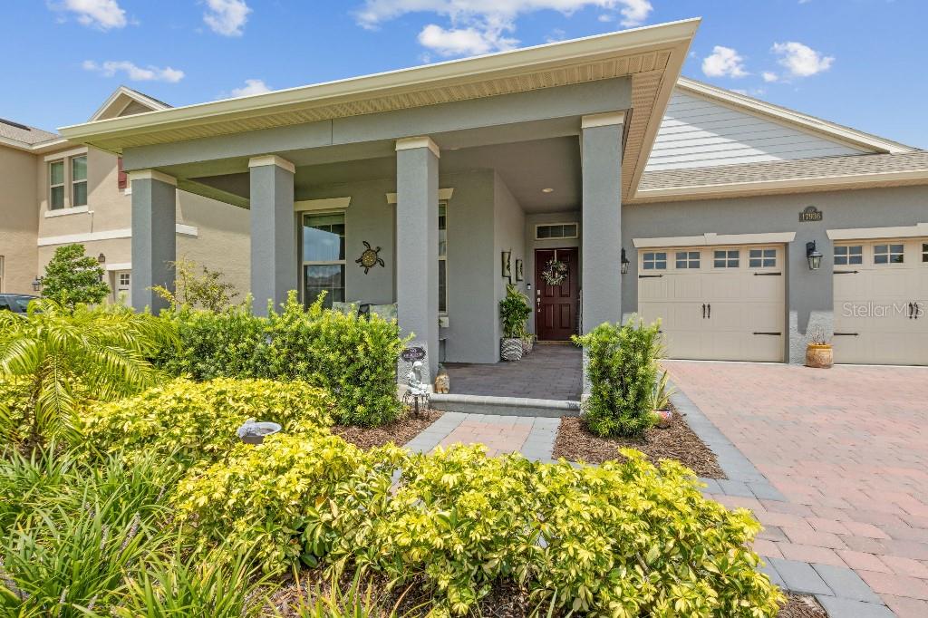 17936 Adrift Road Winter Garden, FL 34787 - Photo 2 of 44 a front view of a house with a yard