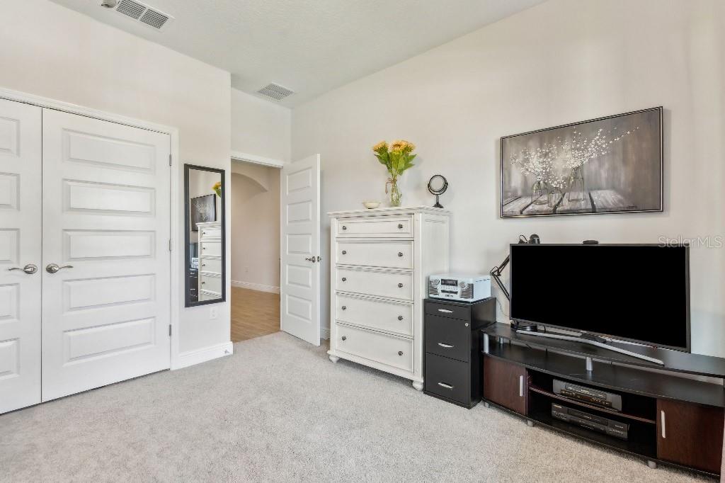 17936 Adrift Road Winter Garden, FL 34787 - Photo 26 of 44 a living room with furniture and a flat screen tv