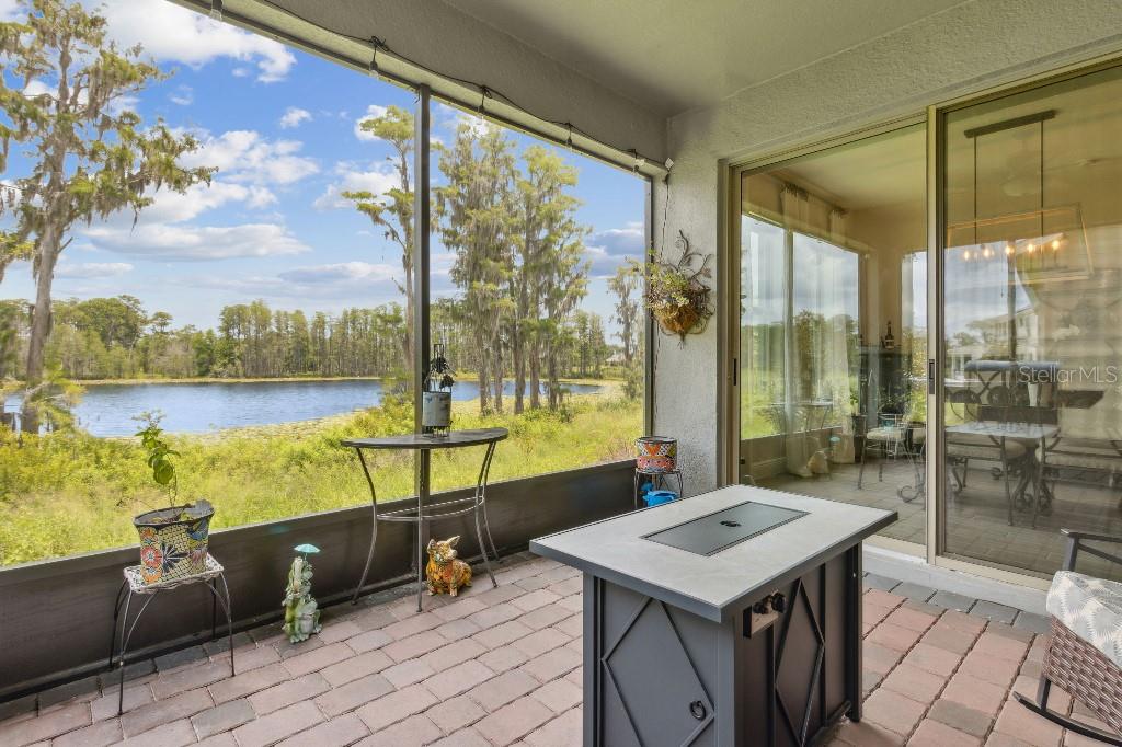 17936 Adrift Road Winter Garden, FL 34787 - Photo 30 of 44 a view of a balcony with couch and wooden floor