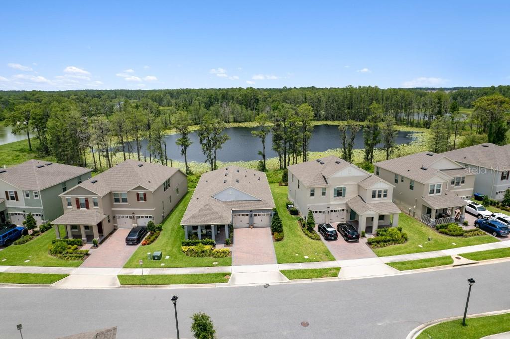 17936 Adrift Road Winter Garden, FL 34787 - Photo 3 of 44 a aerial view of a house with swimming pool and mountains