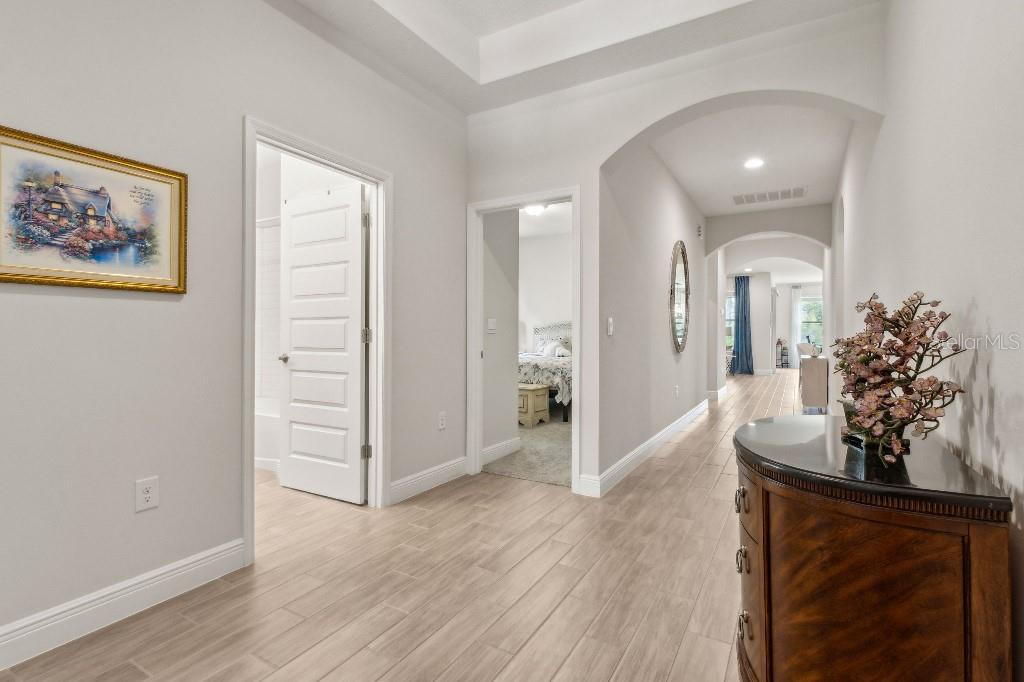 17936 Adrift Road Winter Garden, FL 34787 - Photo 8 of 44 wooden floor in a hall with an entryway