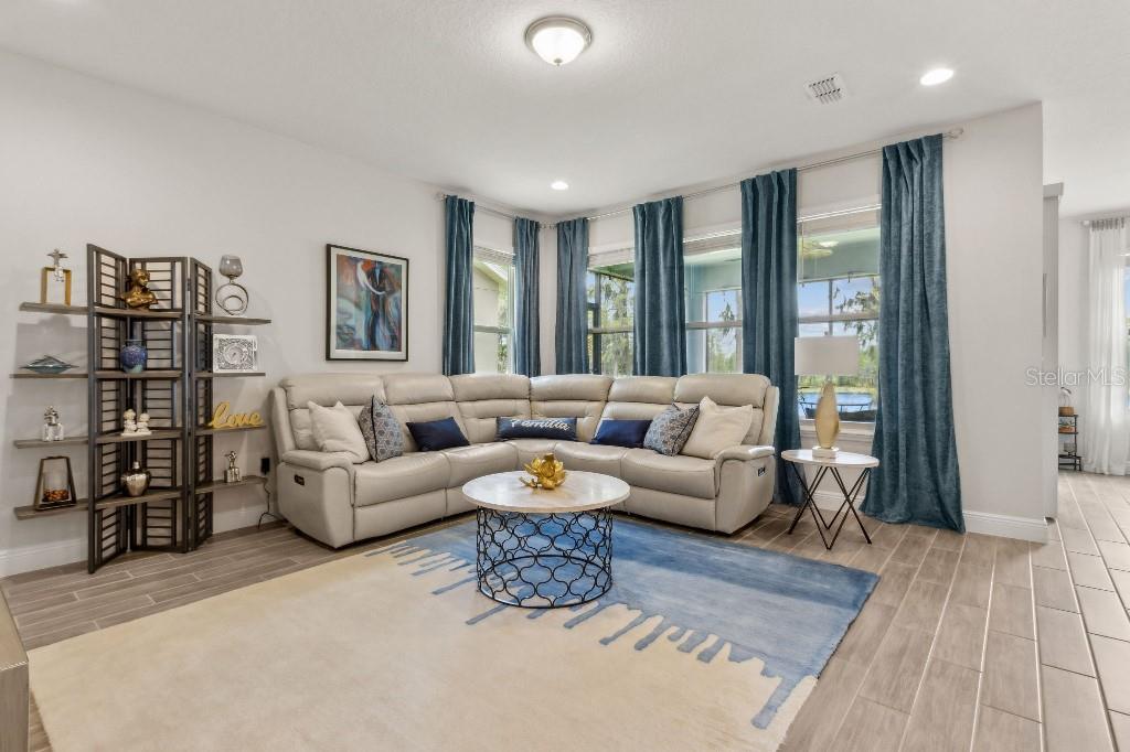 17936 Adrift Road Winter Garden, FL 34787 - Photo 9 of 44 a living room with furniture and large window