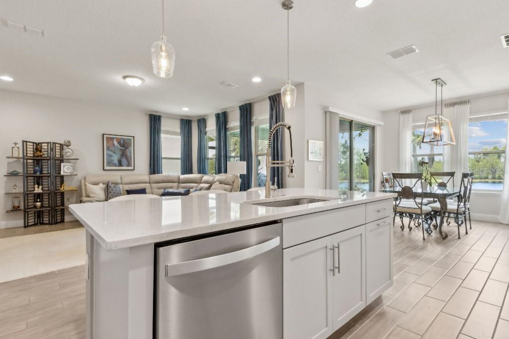 17936 Adrift Road Winter Garden, FL 34787 - Photo 10 of 44 a kitchen with center island table and chairs