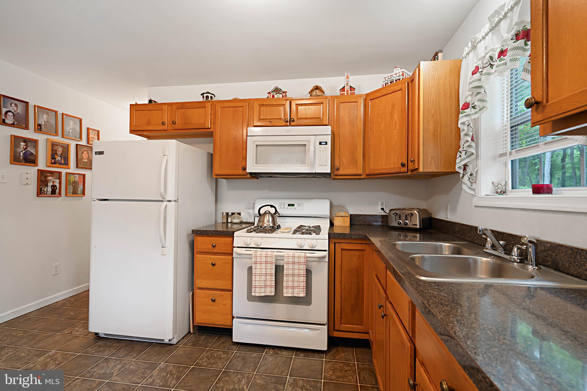 315 Beech Road Millville, NJ 08332 - Photo 7 of 21 a kitchen with stainless steel appliances granite countertop a refrigerator a stove and a sink