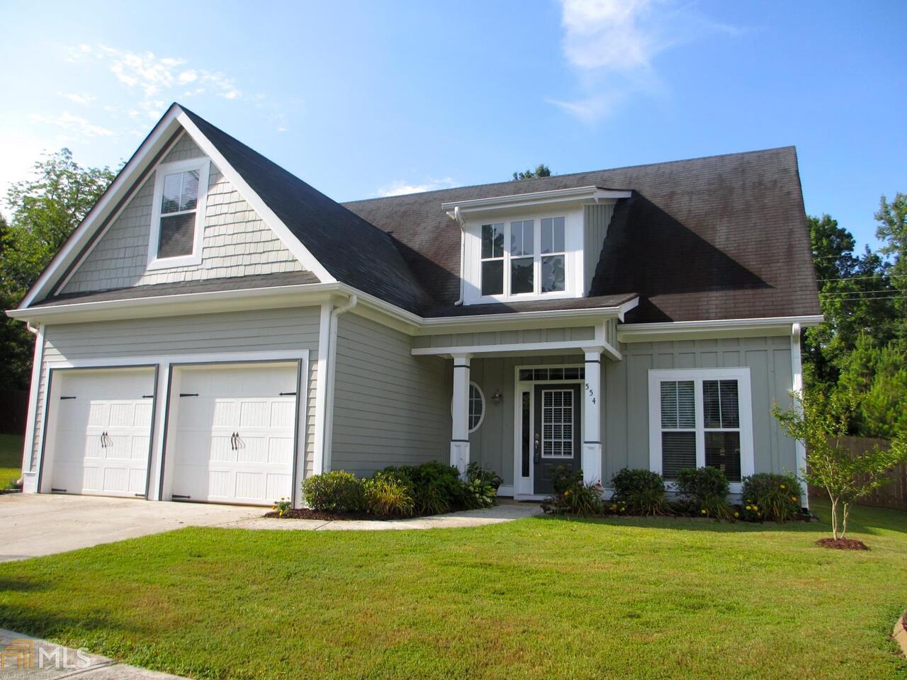 554 Edgewood Drive Athens, GA 30606 - Photo 1 of 1 a front view of a house with a yard and garage