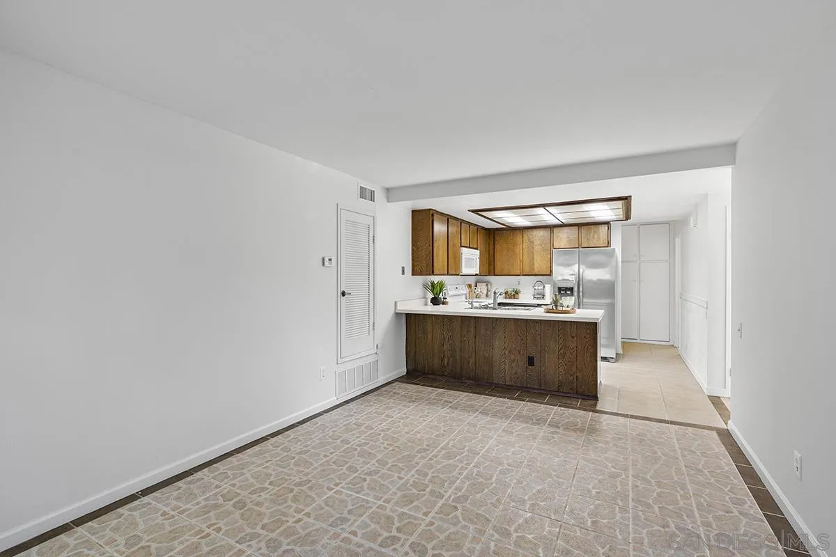 9787 Rimpark Way San Diego, CA 92124 - Photo 16 of 54 a large bathroom with a sink mirror and a bathtub