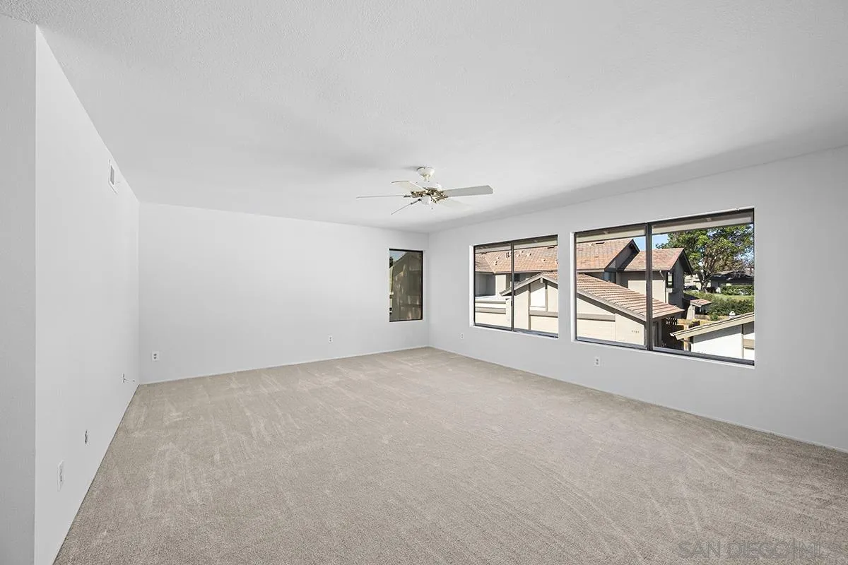 9787 Rimpark Way San Diego, CA 92124 - Photo 29 of 54 an empty room with windows