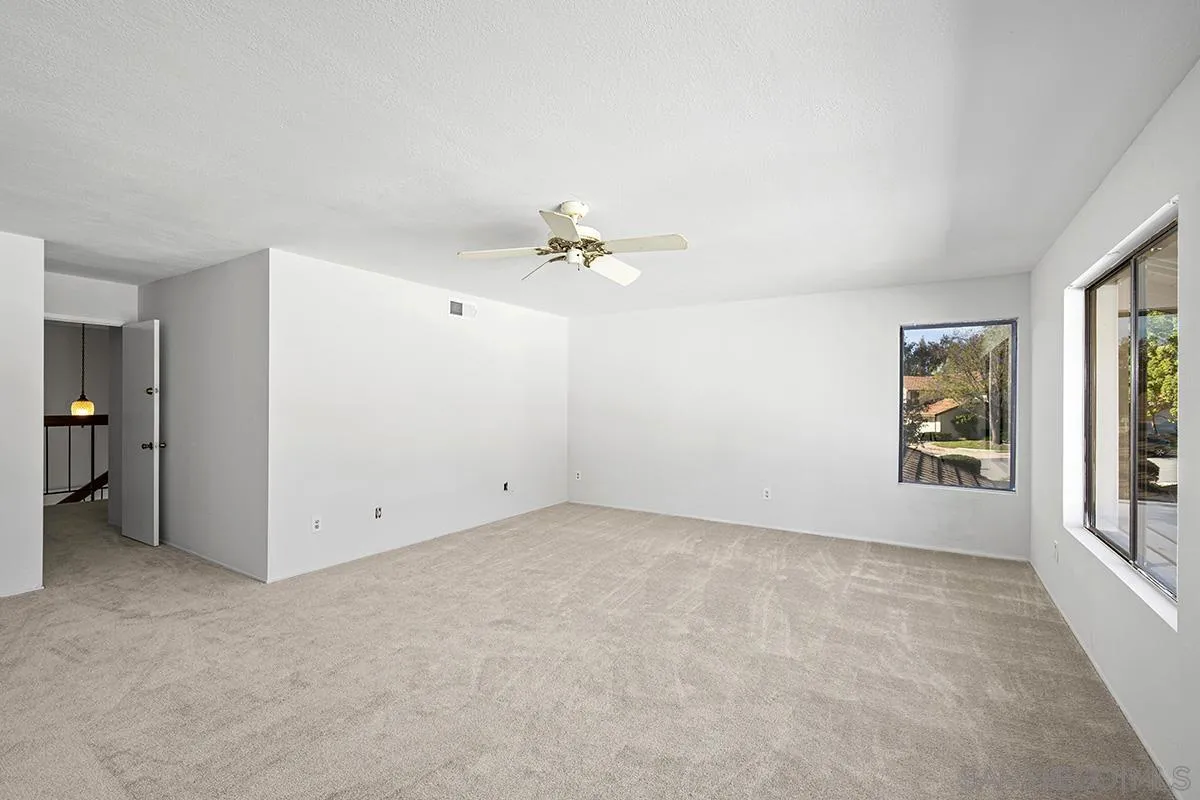 9787 Rimpark Way San Diego, CA 92124 - Photo 31 of 54 wooden floor in an empty room with a window