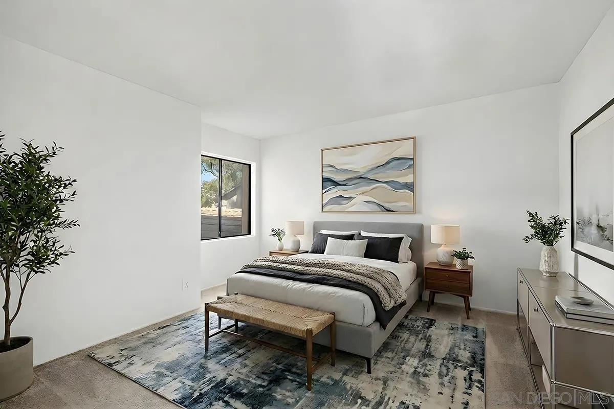 9787 Rimpark Way San Diego, CA 92124 - Photo 32 of 54 a bedroom with a bed and wooden floor