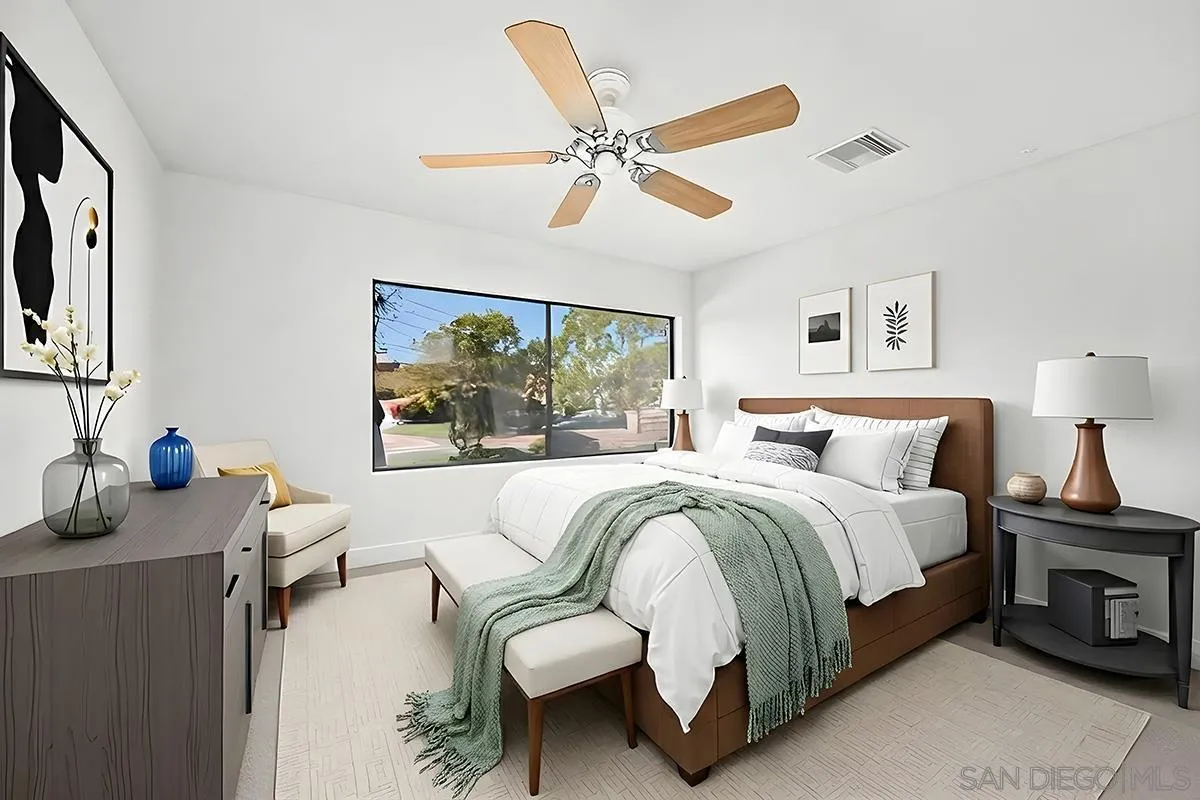 9787 Rimpark Way San Diego, CA 92124 - Photo 35 of 54 a bedroom with a bed and a large mirror