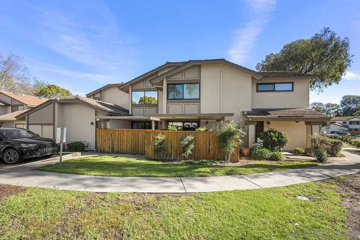 9787 Rimpark Way San Diego, CA 92124 - Photo 40 of 54 a view of a house with a yard