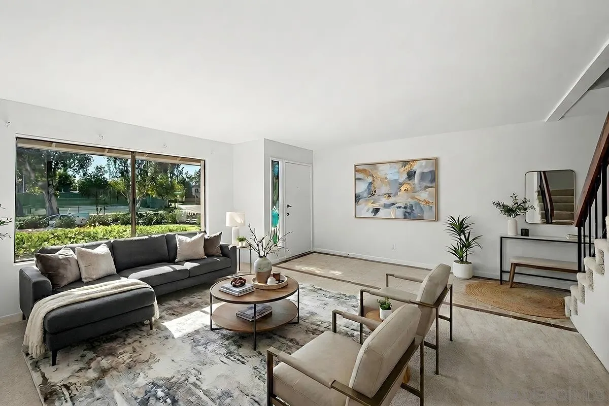 9787 Rimpark Way San Diego, CA 92124 - Photo 4 of 54 a living room with furniture and a large window