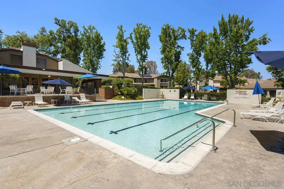 9787 Rimpark Way San Diego, CA 92124 - Photo 47 of 54 a view of a tennis ground with large trees
