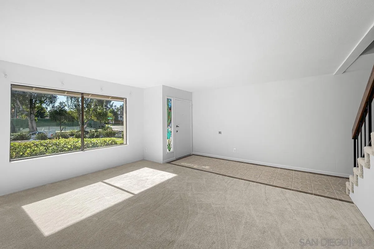 9787 Rimpark Way San Diego, CA 92124 - Photo 5 of 54 an empty room with windows