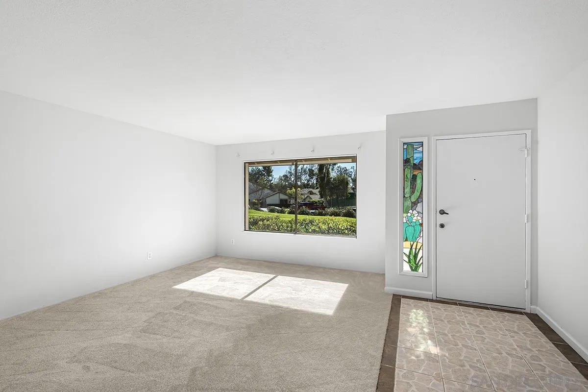 9787 Rimpark Way San Diego, CA 92124 - Photo 6 of 54 an empty room with windows