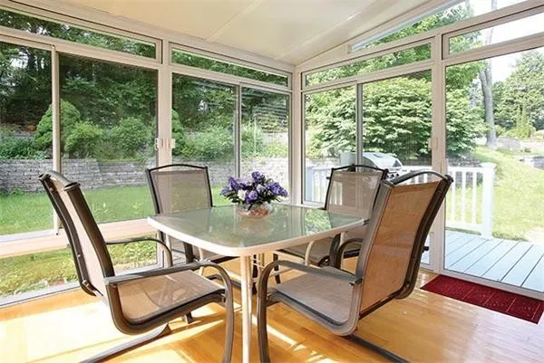 a dining room with furniture water view and balcony