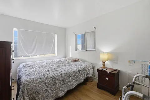 a bedroom with a bed and window
