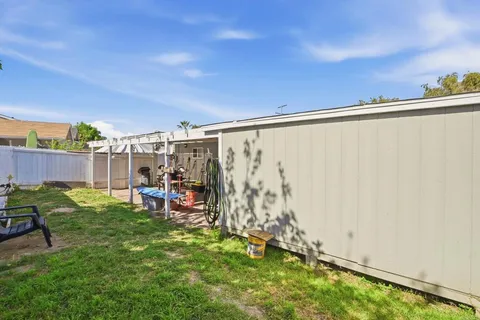 a view of outdoor space with garden and seating area