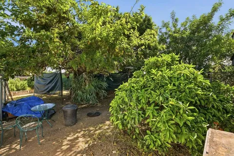 a view of a backyard of the house
