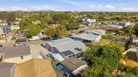 an aerial view of residential houses with outdoor space