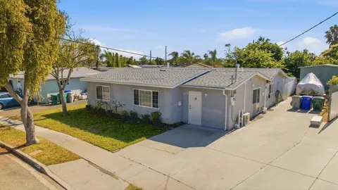 a aerial view of a house with a yard