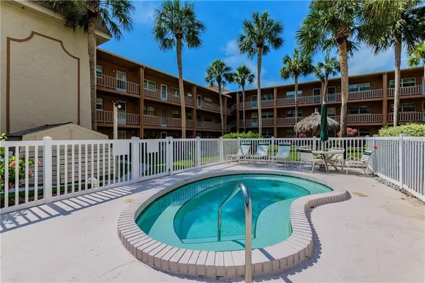 a view of a swimming pool with a patio