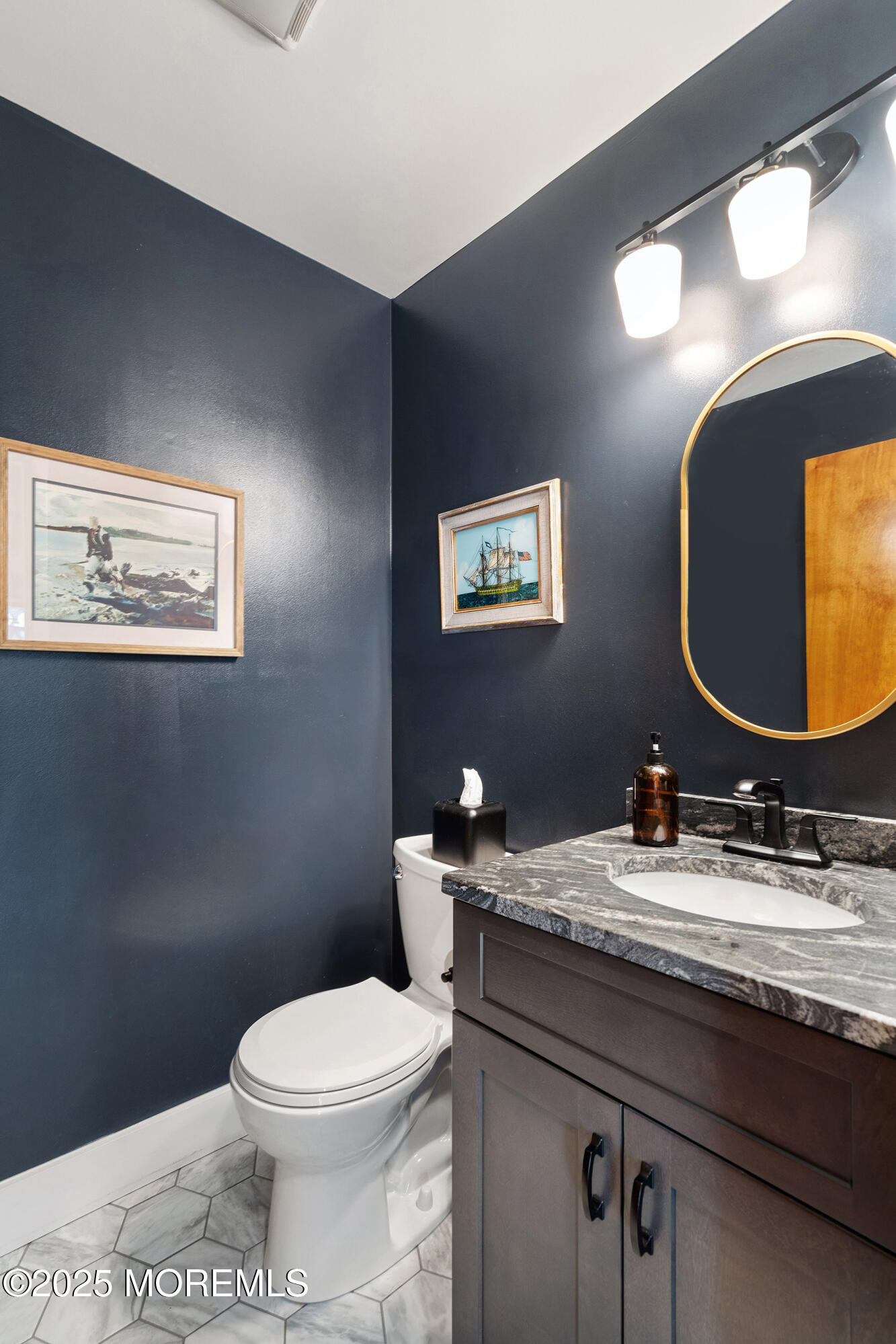 51 White Swan Way Brick, NJ 08723 - Photo 11 of 21 a bathroom with a granite countertop toilet a sink and mirror