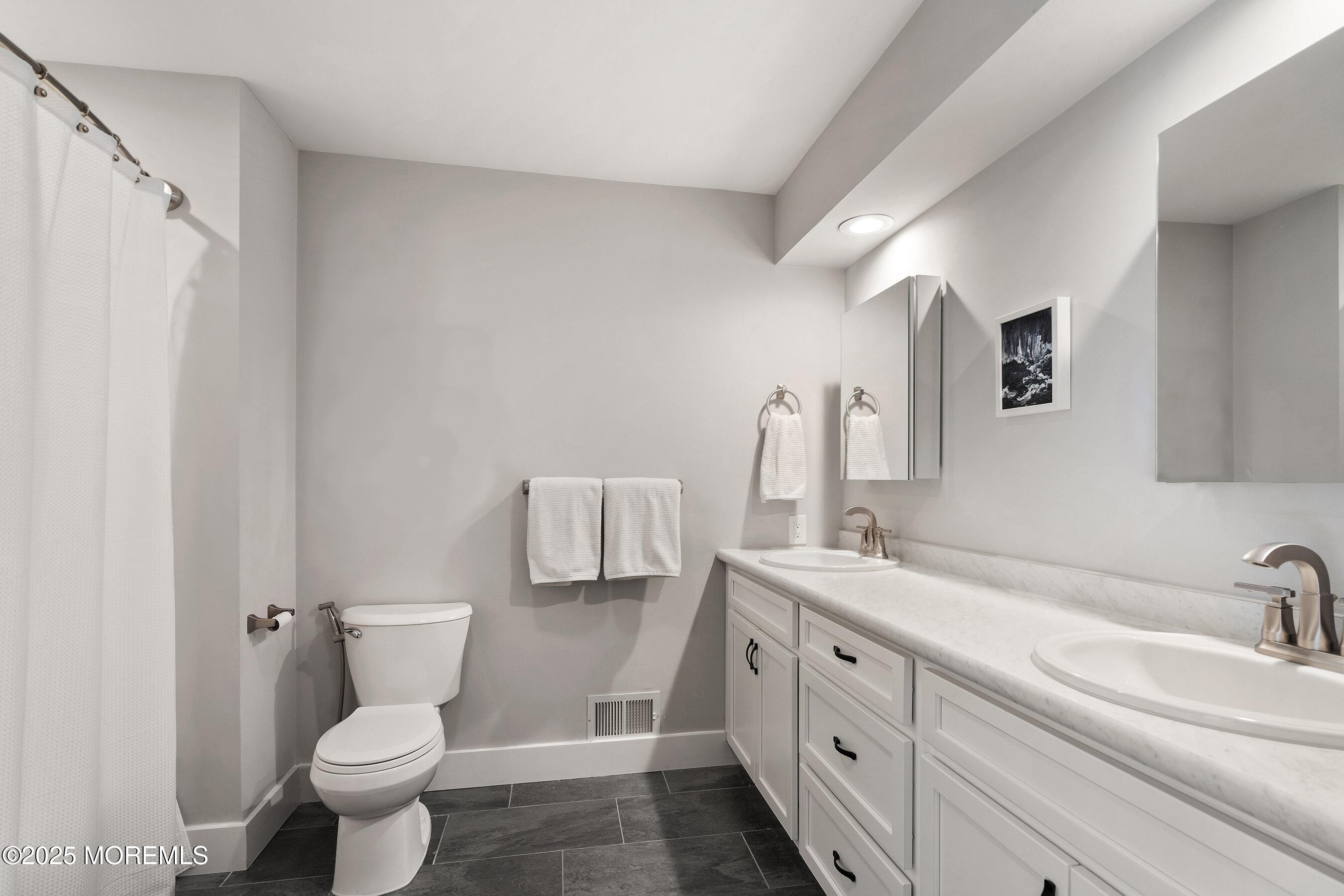 51 White Swan Way Brick, NJ 08723 - Photo 15 of 21 a bathroom with a double vanity sink and mirror
