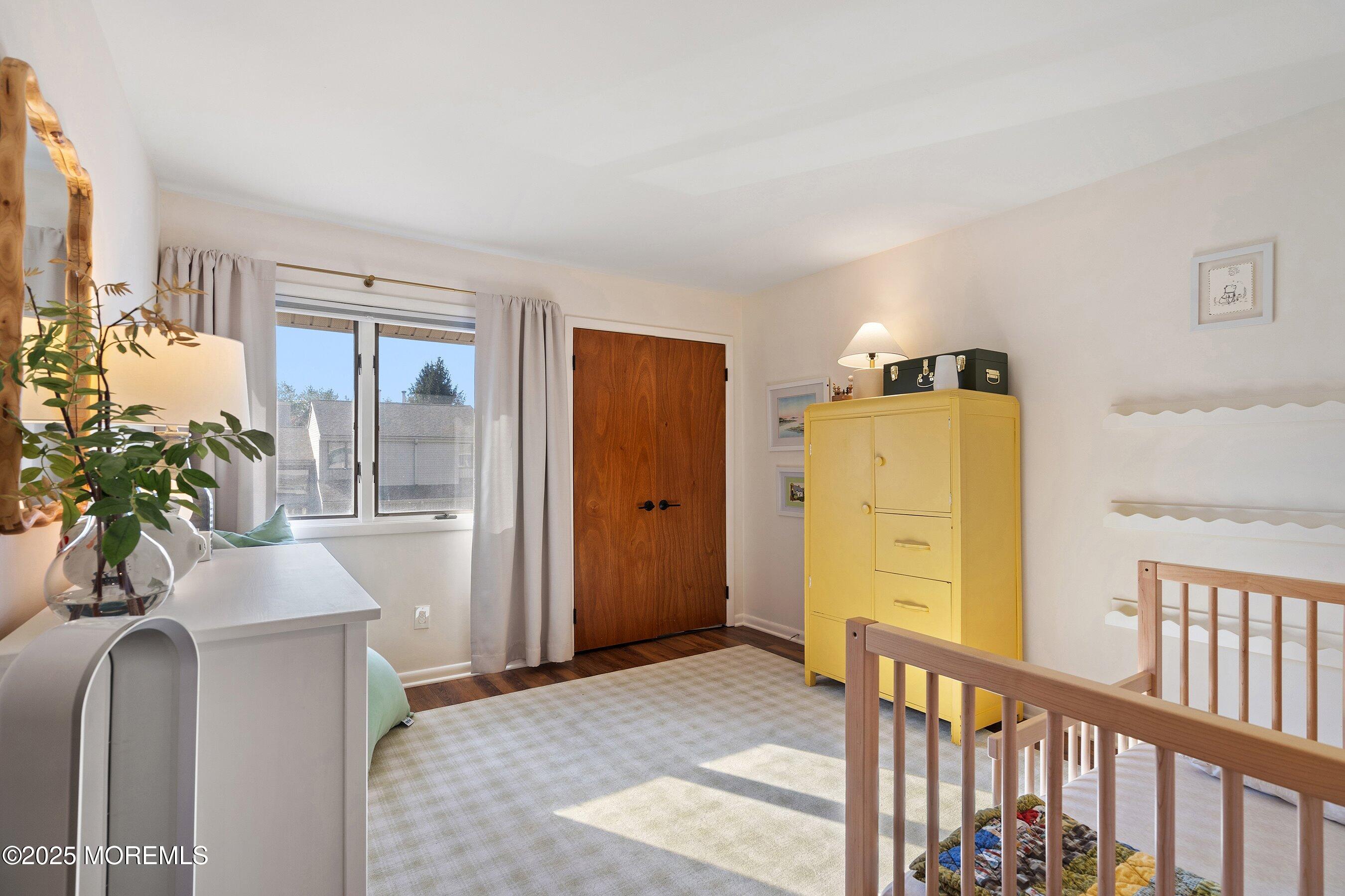 51 White Swan Way Brick, NJ 08723 - Photo 16 of 21 a bedroom with a bed and a potted plant