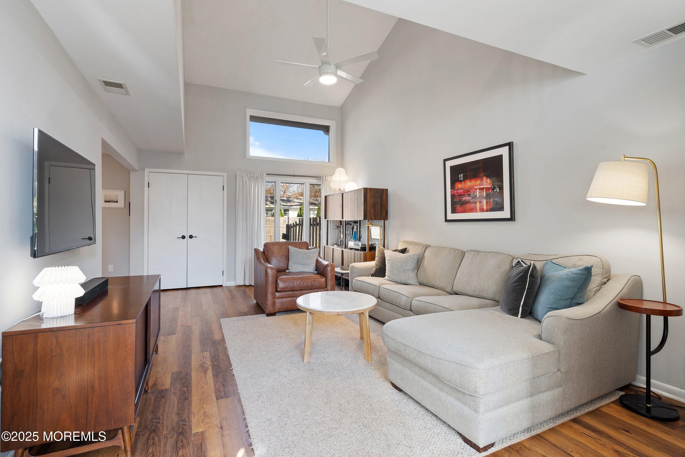 51 White Swan Way Brick, NJ 08723 - Photo 4 of 21 a living room with furniture and a flat screen tv
