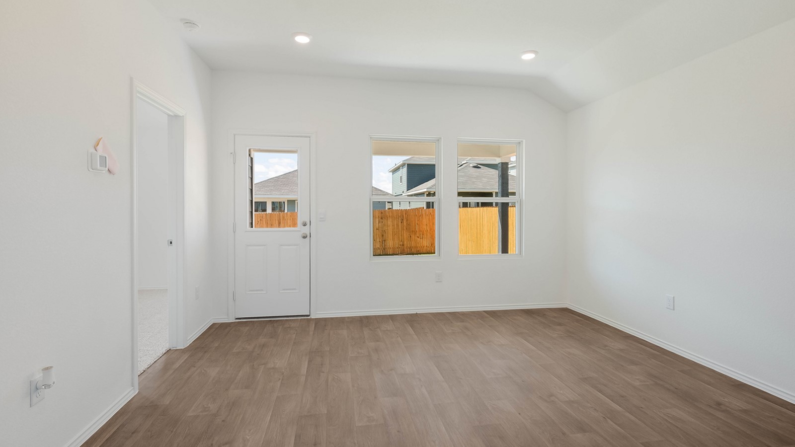 12205 Pike Bend Mustang Ridge, TX 78610 - Photo 9 of 19 an empty room with a window and wooden floor