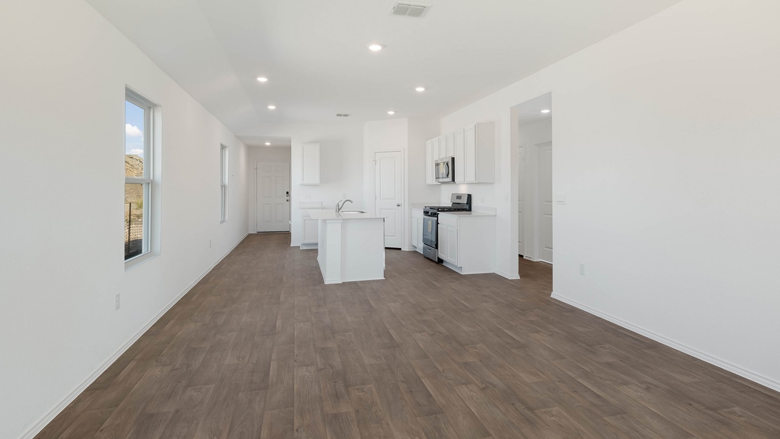 12205 Pike Bend Mustang Ridge, TX 78610 - Photo 10 of 19 a view of empty room with wooden floor