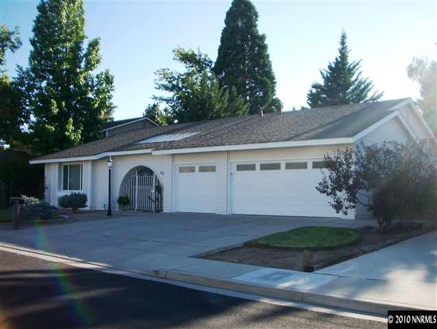 a front view of a house with garage