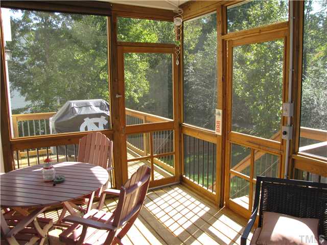 1512 Patterson Grove Road Apex, NC 27502 - Photo 24 of 25 This shot shows the grill on the open deck with access from the Screened Porch. The open deck also has an entrance directly into the kitchen.