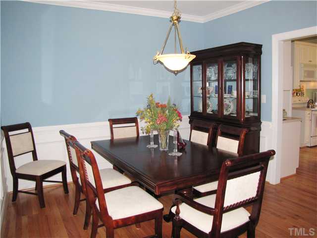 1512 Patterson Grove Road Apex, NC 27502 - Photo 6 of 25 The formal Dining Room includes hardwood flooring and is heavy with trim molding. There is also a nice double window to the left.