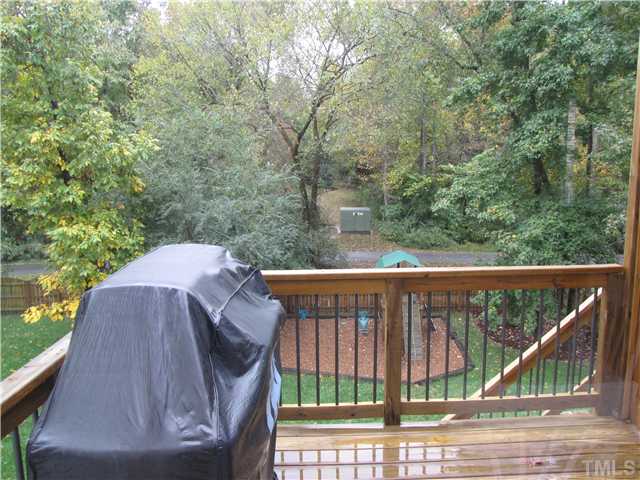 1512 Patterson Grove Road Apex, NC 27502 - Photo 10 of 25 This is the view of the deck and back yard from the Breakfast Nook. The Greenway Trail runs parallel the back fence line!