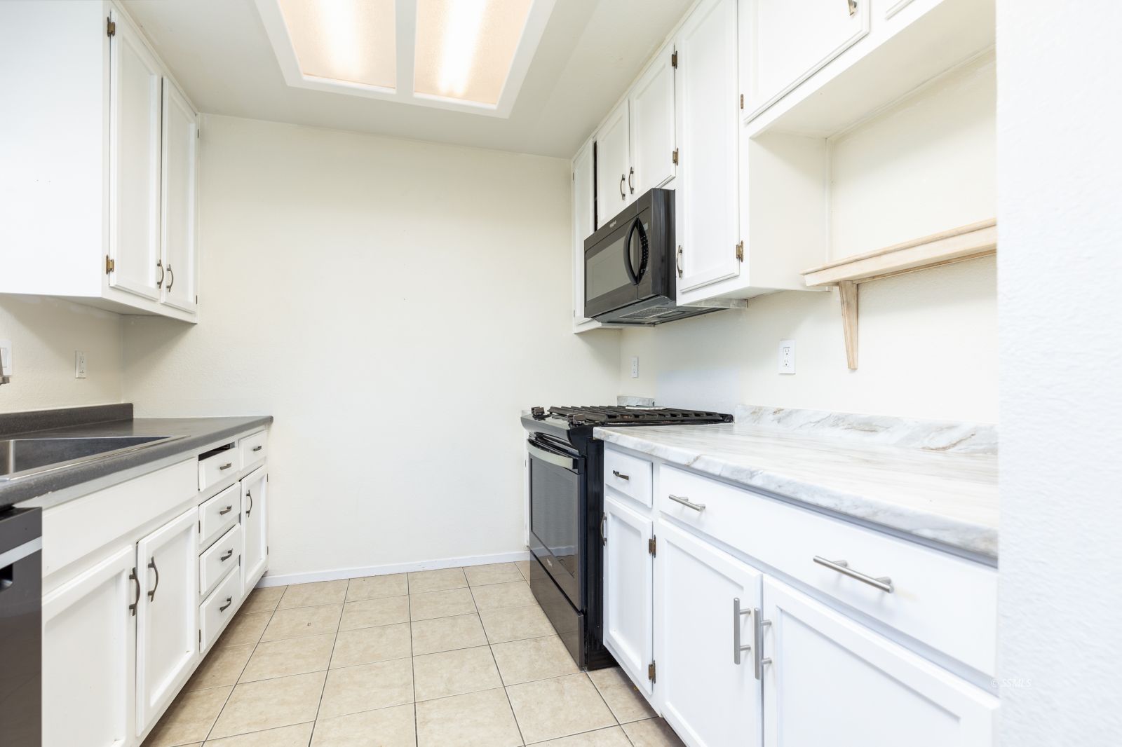 918 West Hughes Avenue Ridgecrest, CA 93555 - Photo 12 of 25 a kitchen with stainless steel appliances granite countertop a sink and a stove