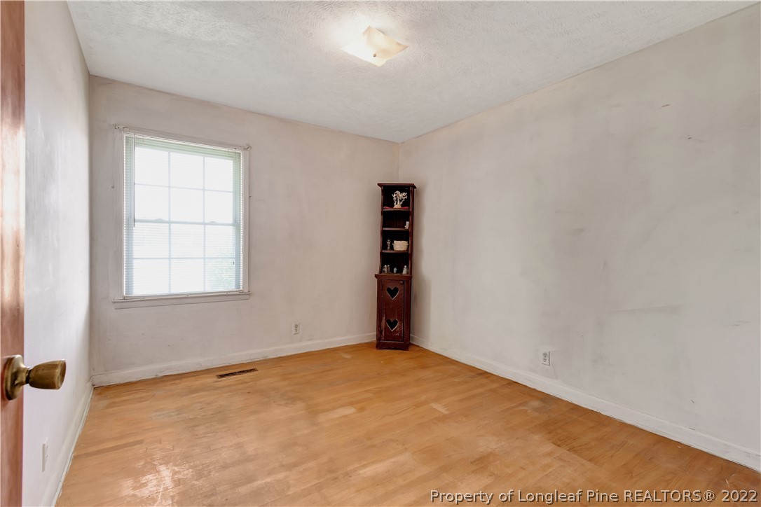 7400 East Raynham Road Fairmont, NC 28340 - Photo 11 of 21 an empty room with windows