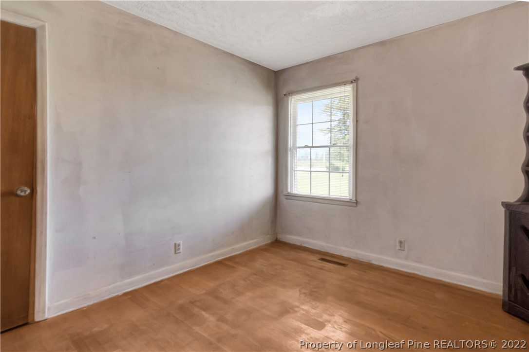 7400 East Raynham Road Fairmont, NC 28340 - Photo 12 of 21 a view of an empty room with a window