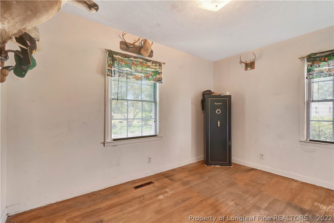 7400 East Raynham Road Fairmont, NC 28340 - Photo 13 of 21 a view of an empty room with a window