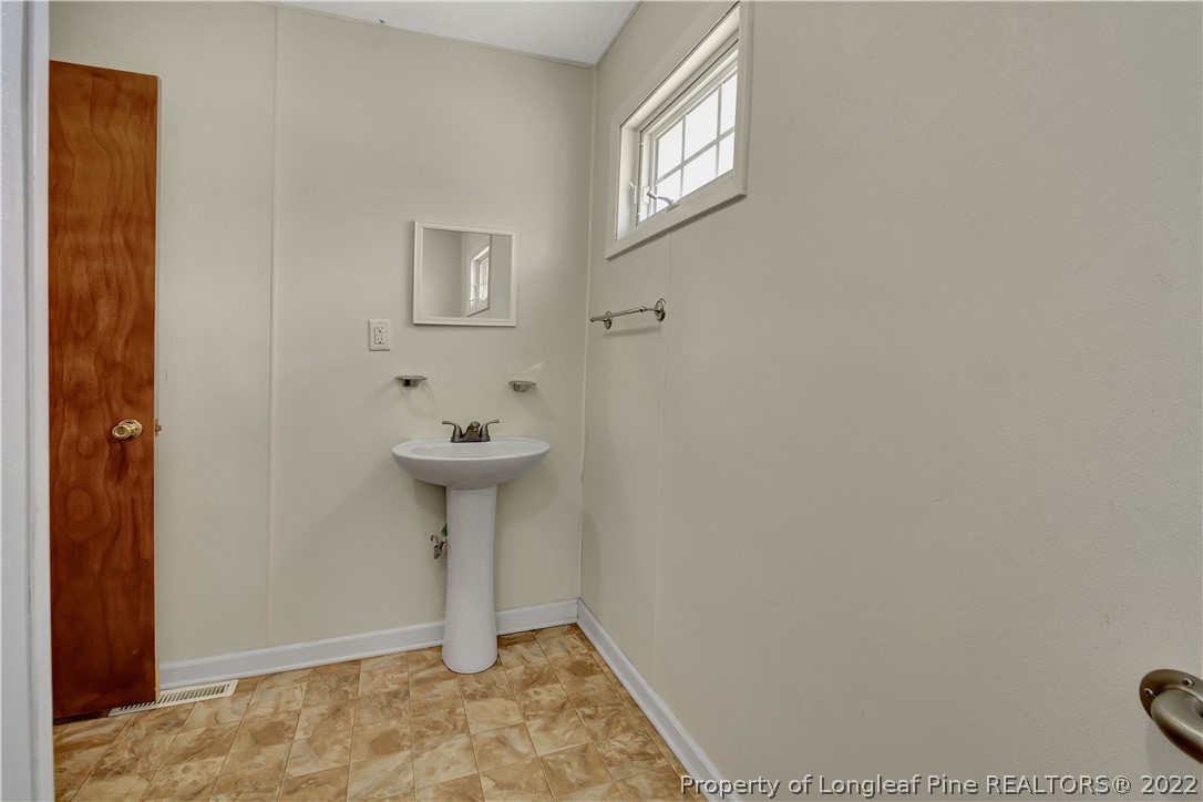 7400 East Raynham Road Fairmont, NC 28340 - Photo 17 of 21 a view of a hallway with closet