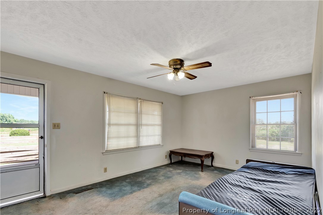 7400 East Raynham Road Fairmont, NC 28340 - Photo 5 of 21 a view of an empty room with a window