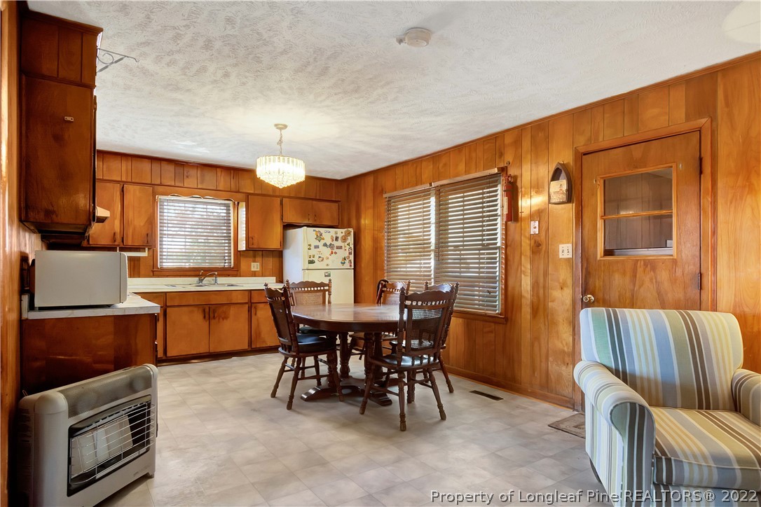 7400 East Raynham Road Fairmont, NC 28340 - Photo 7 of 21 a view of a dining room with furniture window and outside view