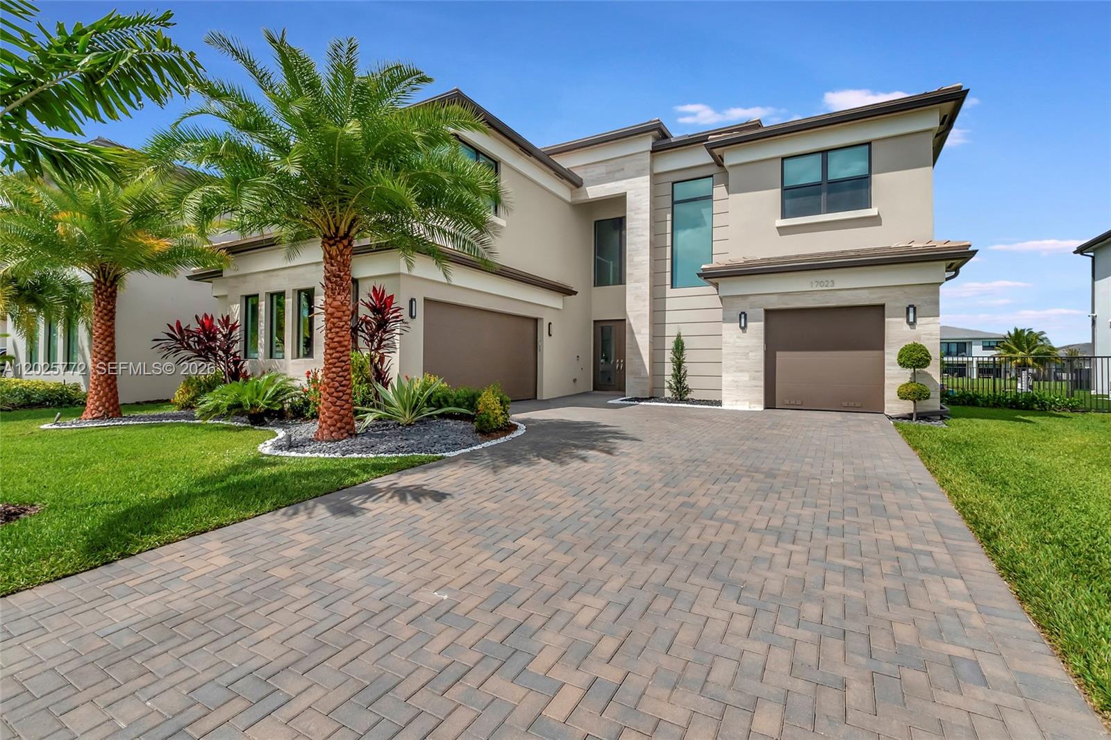 17023 Wandering Wave Avenue Boca Raton, FL 33496 - Photo 7 of 84 a front view of house with yard and green space