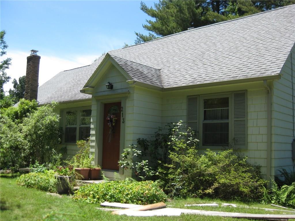 213 Crystal Lake Road Tolland, CT 06084 - Photo 1 of 1 a front view of a house with garden
