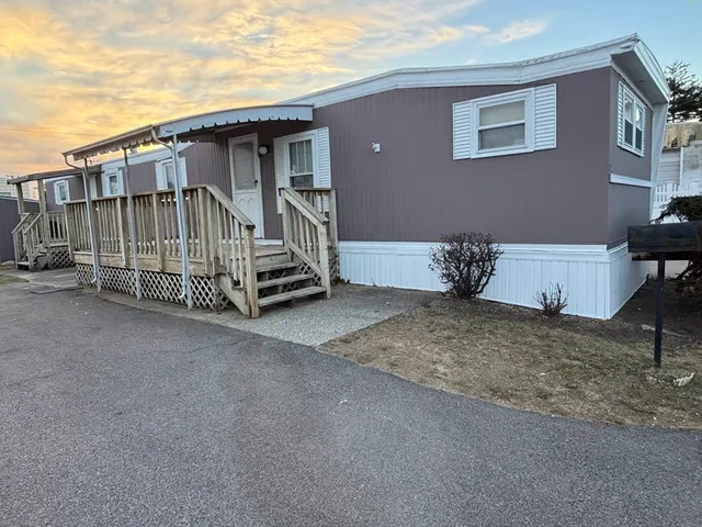 a kitchen with granite countertop a stove sink and cabinets