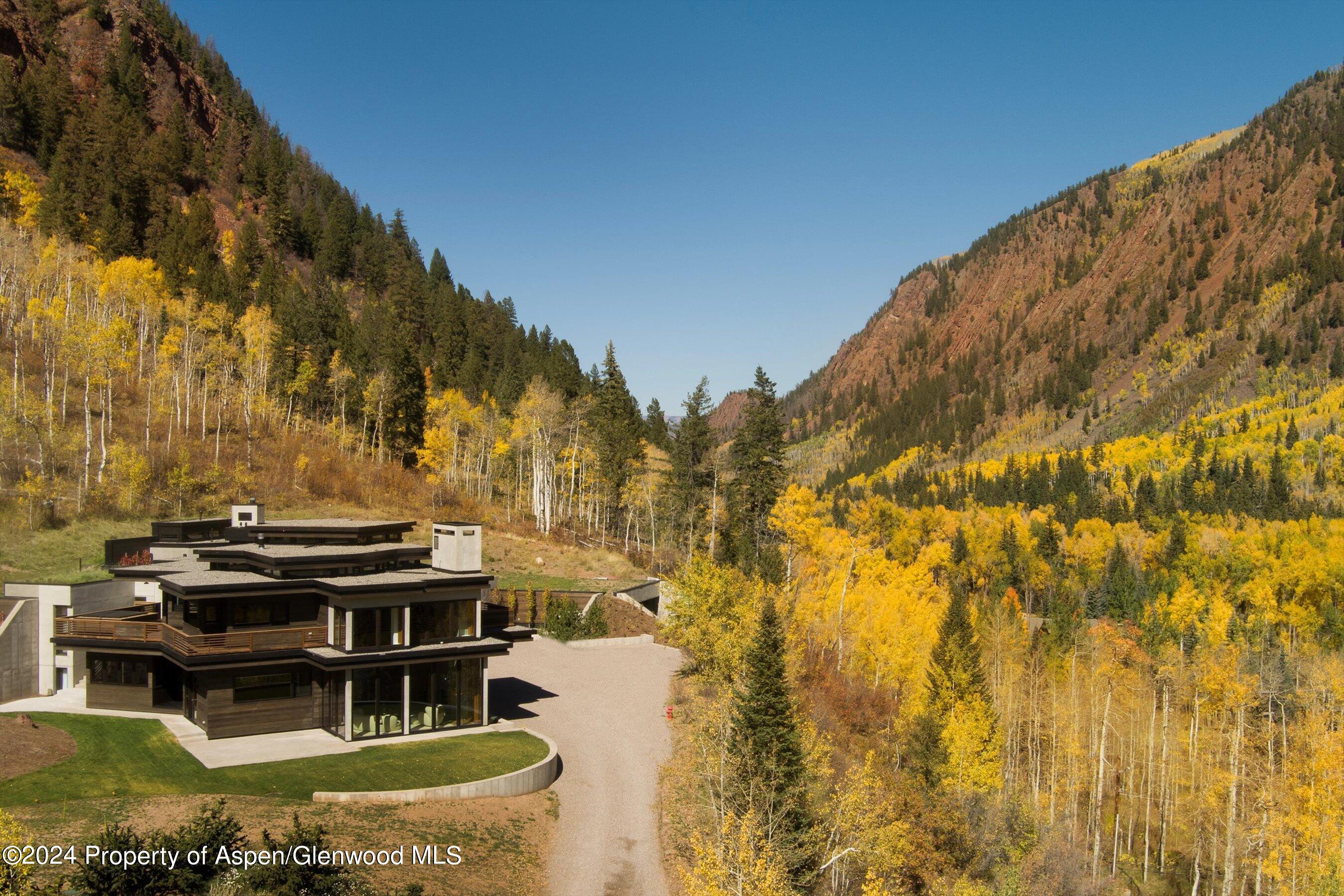255 Conundrum Creek Road Aspen, CO 81611 - Photo 21 of 21 a view of a swimming pool with a yard