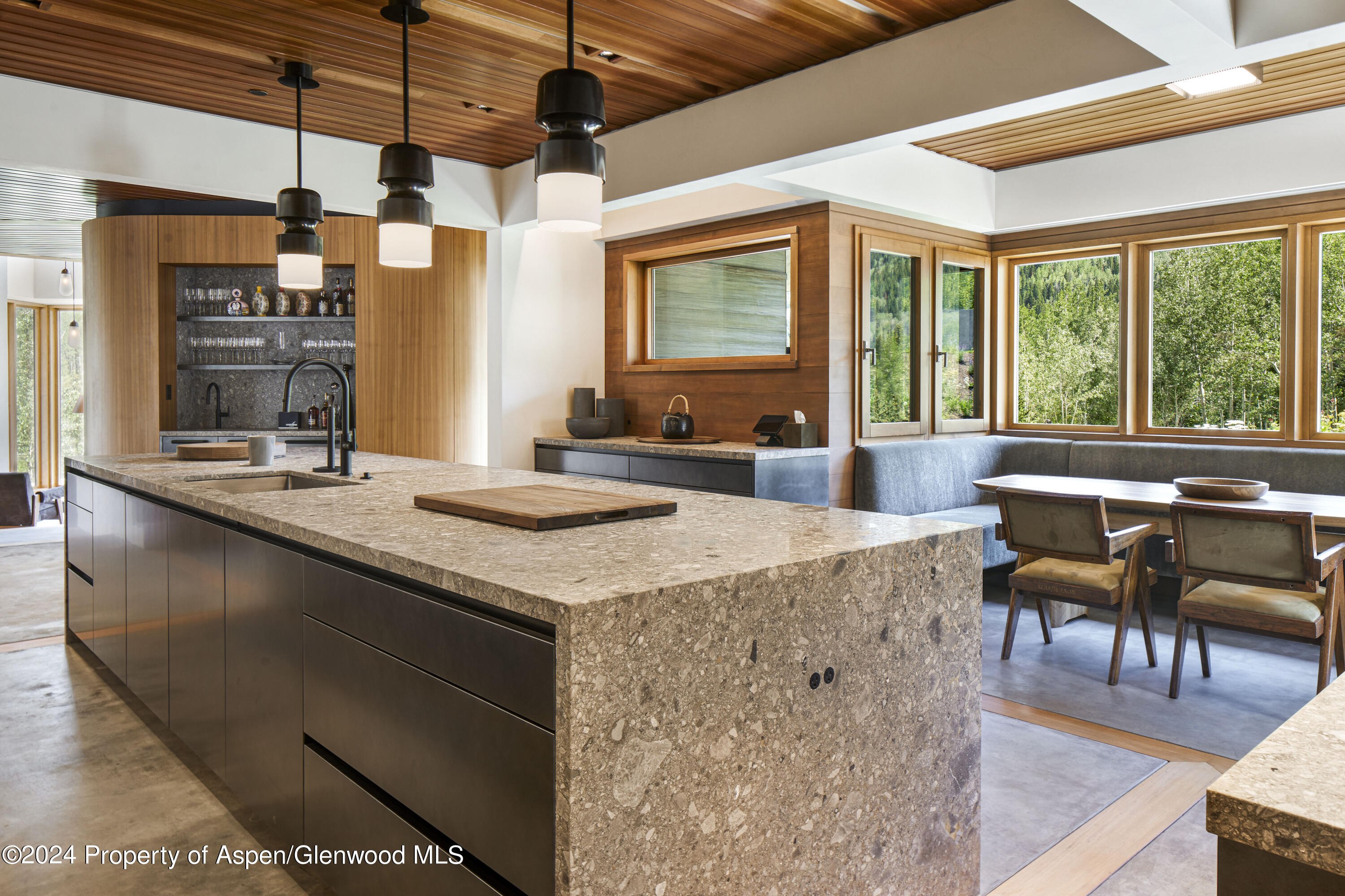 255 Conundrum Creek Road Aspen, CO 81611 - Photo 5 of 21 a kitchen with stainless steel appliances granite countertop a stove a sink and a dining table view