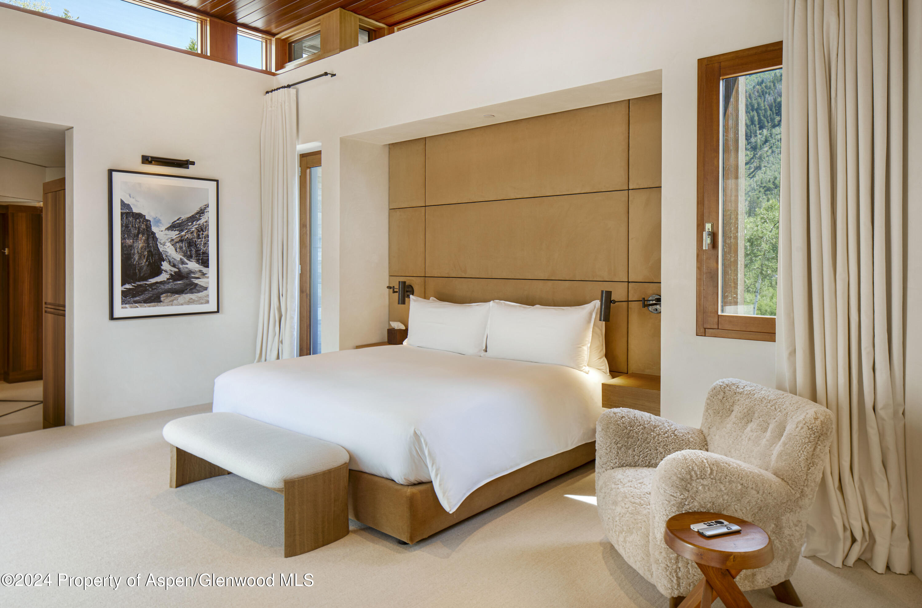 255 Conundrum Creek Road Aspen, CO 81611 - Photo 6 of 21 a bedroom with a bed and wooden floor